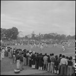 Représentation de vélocipédistes  lors d'une grande réunion des élèves catholiques au stade Mangin.