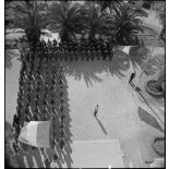 Rassemblement pour la cérémonie des couleurs au centre d'hébergement installé dans le Golf Hôtel.