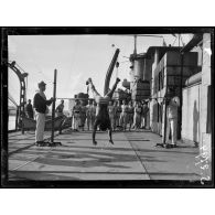 Courfou. A bord du Waldeck-Rousseau. Séance d'exercices physiques. [légende d'origine]