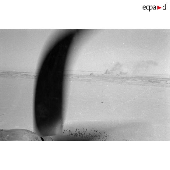 Dans un Heinkel He-111 lors d'une mission de bombardement au sein du Kampfgruppe 100 (KG 100).