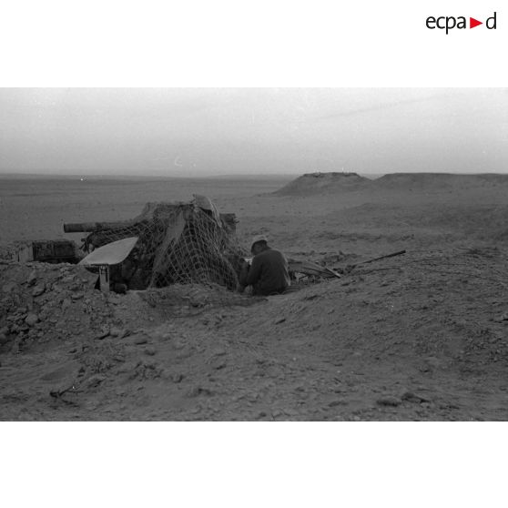 Une alvéole occupé par une pièce de prise Ordnance QF de 25.