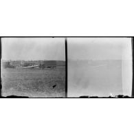 [Deux camions Berliet sur un terrain d'atterrissage].