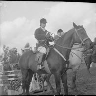 Une compétition hippique. [Description en cours]