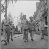 Prise d'armes à Bône en l'honneur des trois soldats français assassinés par le FLN. [Description en cours]