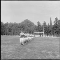 Constantine. Finale interarmées de rugby. Arrivée sur le terrain des équipes.