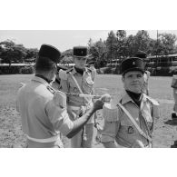 Musique militaire du régiment d’infanterie de marine du Pacifique - Polynésie (RIMAP-P) lors de la prise d'armes pour la remise de la fourragère à de jeunes marsouins à Taravao.