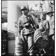 Portrait d'un légionnaire de la 13e DBMLE à bord d'un paquebot/transport de troupes.