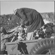 Chantiers de la Défense et Restauration des sols (DRS). Evacuation des pierres avec les divers moyens modernes employés.