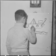 Le club du jeudi en Algérie. Un enfant dessine suivant son goût.