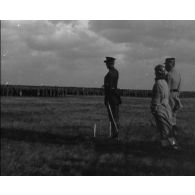 [Revue d'adieux du roi des Belges.]