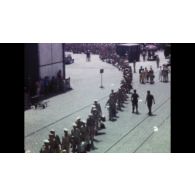 Fonds cinématographique de Pierre Marrel. Film « Bône (Annaba) / Marseille sur le Sidi Bel Abbès. Sortie de la messe à Jons et rentrée à Jonage. Maman monte en voiture ».