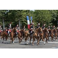 Défilé de la fanfare du régiment de cavalerie de la Garde républicaine sur les Champs-Elysées, lors du 14 juillet 2018 à Paris.