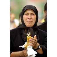 Portrait de fidèles lors de la cérémonie religieuse du PMI (pèlerinage international millitaire) de Letnica.