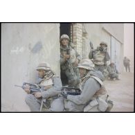 Dans une rue d'Al Salman, un groupe de combat du 3e RIMa (régiment d'infanterie de marine), en mission de reconnaissance lors de la prise de la ville, se tient posté à l'angle d'une maison.