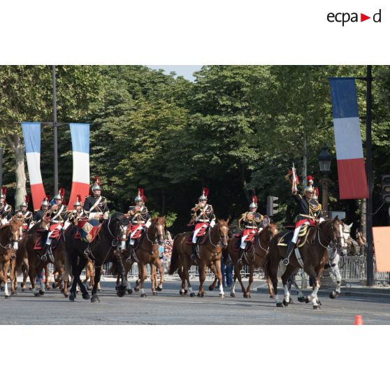 Défilé de la fanfare du régiment de cavalerie de la Garde républicaine sur les Champs-Elysées, lors du 14 juillet 2018 à Paris.