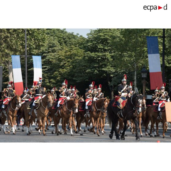 Défilé de la fanfare du régiment de cavalerie de la Garde républicaine sur les Champs-Elysées, lors du 14 juillet 2018 à Paris.